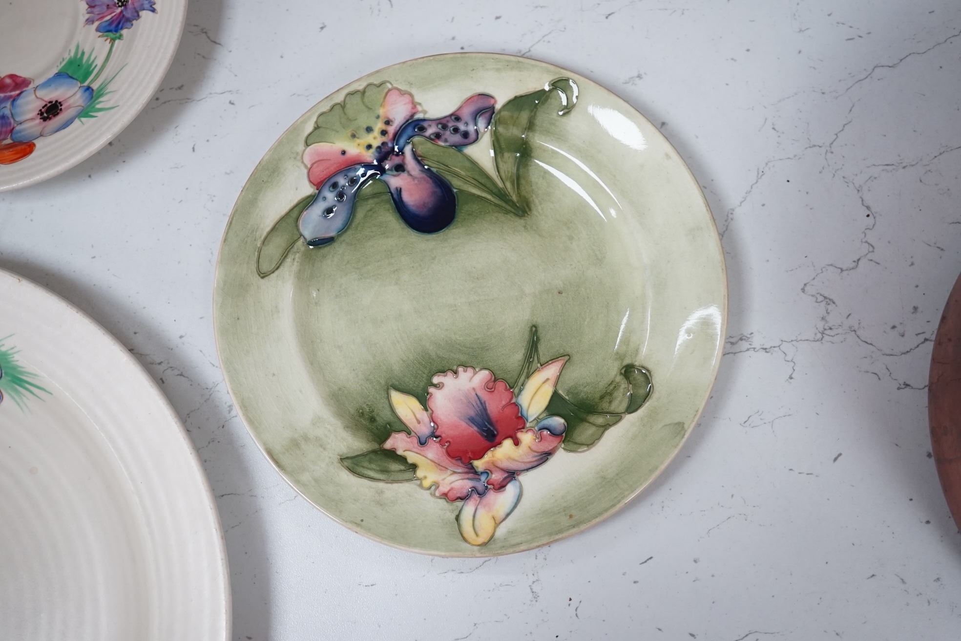 A pair of Moorcroft side plates and two plates Clarice Cliff plates. Condition - fair to good